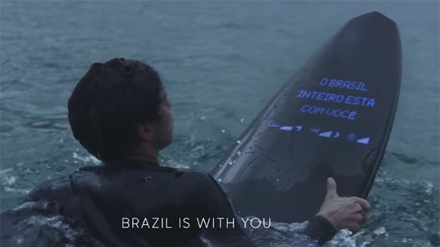A surfboard screen showing a message from fans