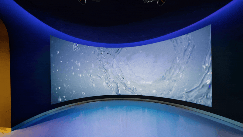 The curved water screen wrapping the immersive room