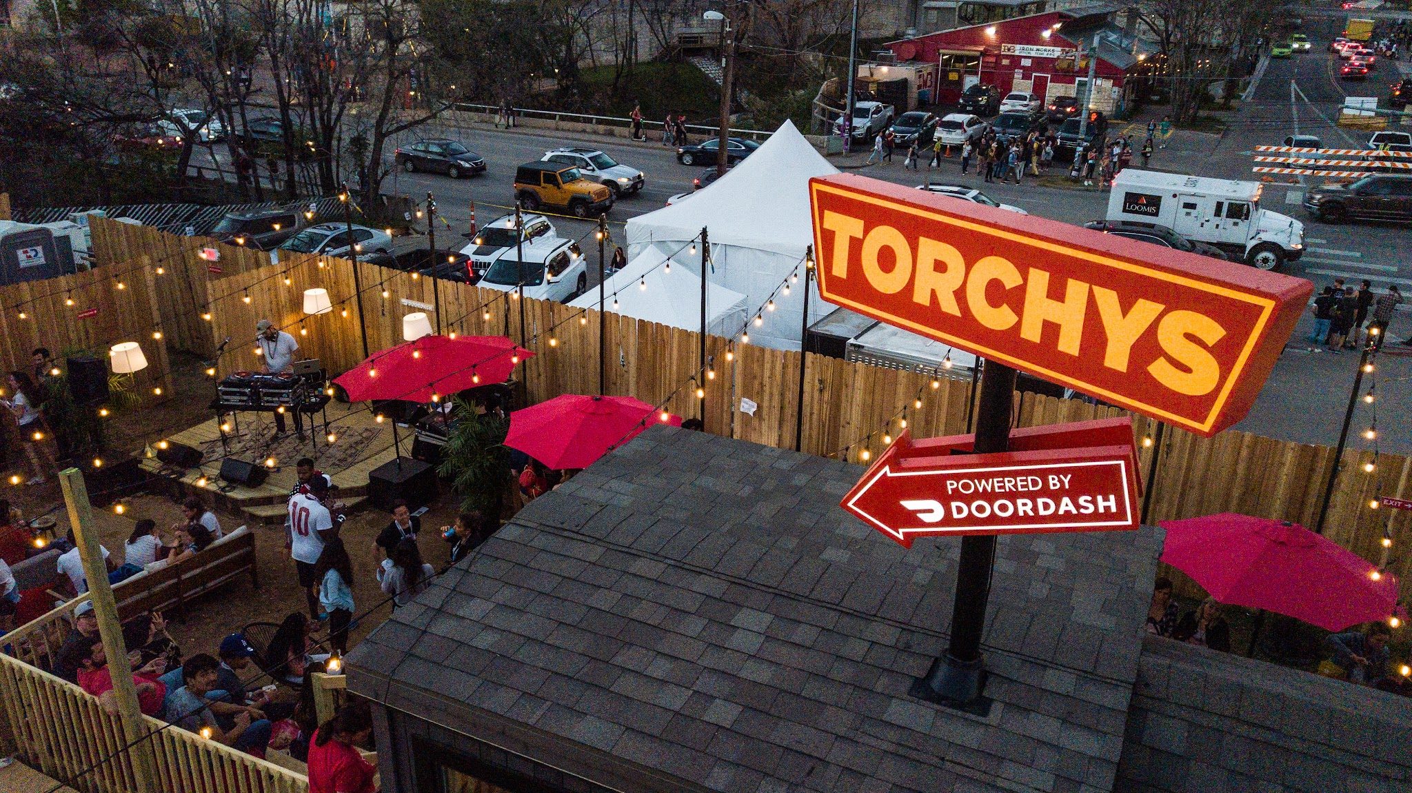 The Torchy's Tacos patio under string lights