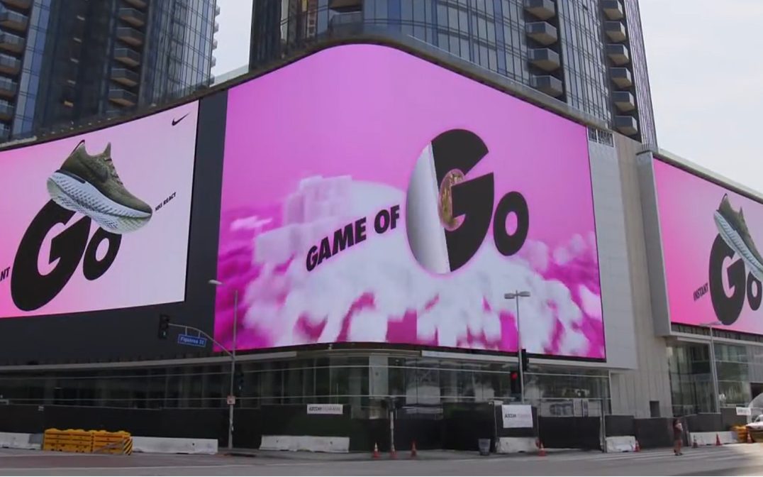 The Game of Go billboard takeover above the plaza