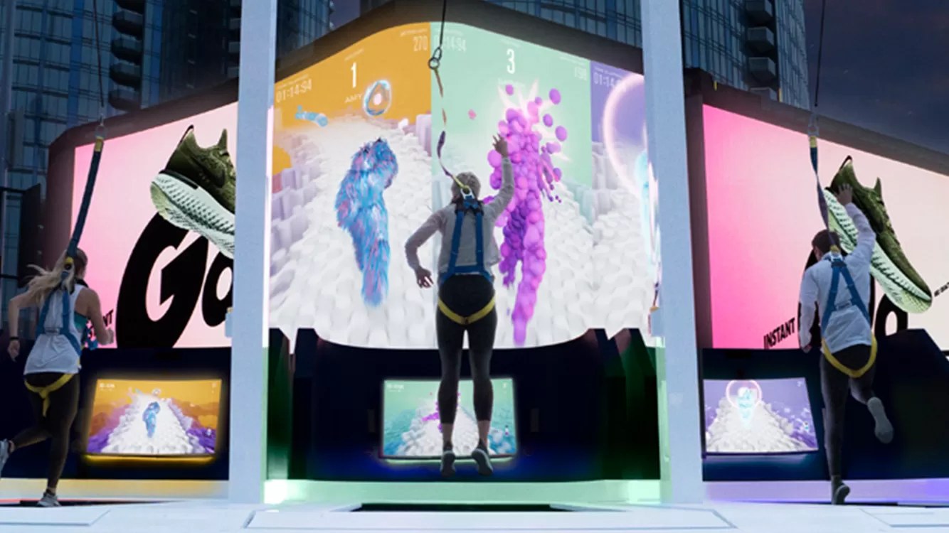 Three runners chasing each other on the big screens