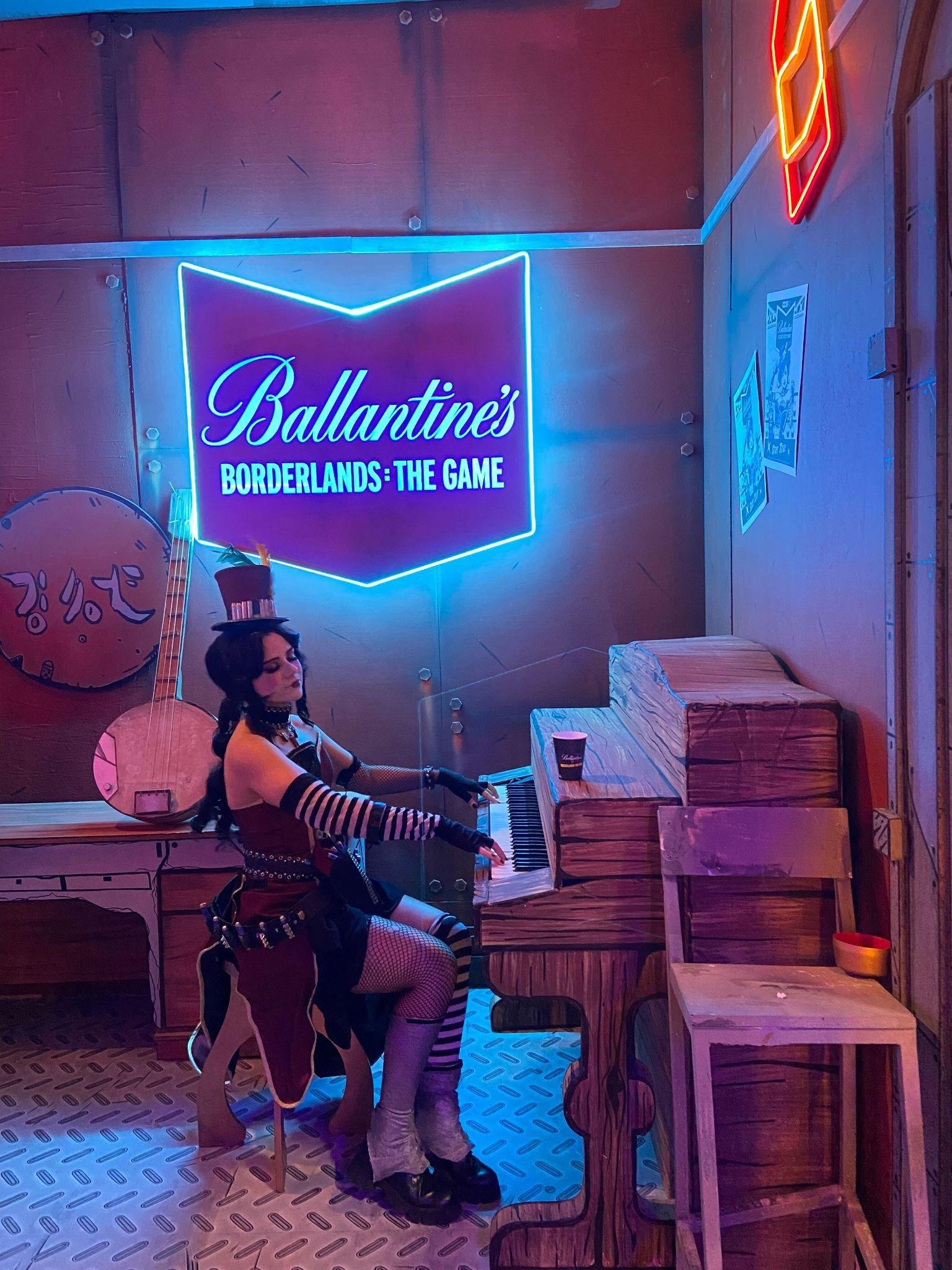 Moxxi at the bar beneath her neon sign