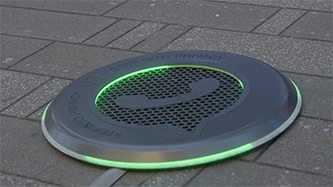 The spot's directional speaker disc glowing green
