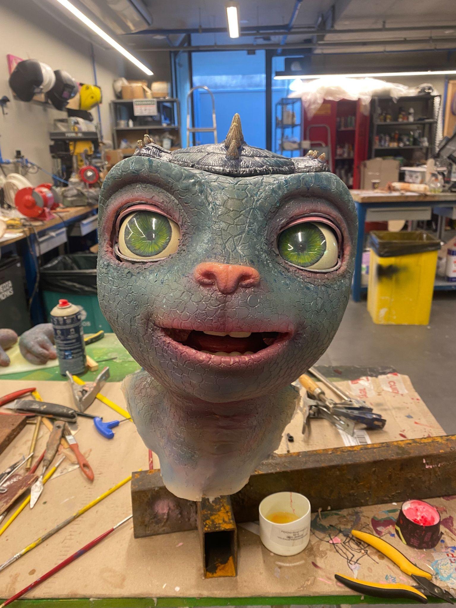 The sculpted head taking shape in the workshop