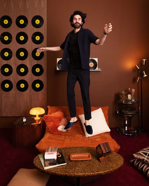 JOAN's record wall, smiley 45s on walnut